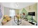 Modern office space with geometric wall design, desk, shelves and bright lighting at 2022 Hawks View Dr, Ruskin, FL 33570