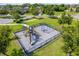 Community playground with swings, a slide, and a fenced-in area for safety at 2022 Hawks View Dr, Ruskin, FL 33570