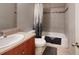 Bathroom with a shower-tub combination, white fixtures, a modern vanity and decorative tiled accents at 22798 Penny Loop, Land O Lakes, FL 34639