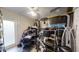 A storage room containing a multitude of boxed and loose items and sporting overhead lighting at 22798 Penny Loop, Land O Lakes, FL 34639