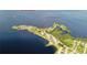 Aerial view of 26 Harborpointe Dr waterfront homes on a scenic peninsula with a gulf view at 26 Harborpointe Dr, Port Richey, FL 34668