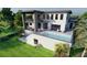 Modern two-story home with a pool and spacious outdoor living area at 26 Harborpointe Dr, Port Richey, FL 34668