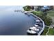 Aerial view of a waterfront property showcasing the private boat dock and canal access at 26 Harborpointe Dr, Port Richey, FL 34668