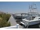 View of a private boat dock featuring multiple boats at 26 Harborpointe Dr, Port Richey, FL 34668
