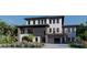 Two-story home featuring modern design, balconies, and a well-manicured front yard at 26 Harborpointe Dr, Port Richey, FL 34668