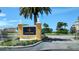 Harbor Pointe community sign with palm trees and manicured landscaping at 26 Harborpointe Dr, Port Richey, FL 34668