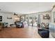 Comfortable living room with a ceiling fan, hardwood floors, and sliding glass doors at 2714 Witley Ave, Palm Harbor, FL 34685