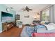 Relaxing living room with a ceiling fan, hardwood floors, a large sofa, and plenty of light at 2714 Witley Ave, Palm Harbor, FL 34685