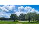 Community basketball court surrounded by lush greenery, offering a great outdoor recreational space at 2957 Hickory Grove Dr, Valrico, FL 33596