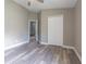 Bedroom featuring hard surface floors, neutral colored walls, and a closet at 2957 Hickory Grove Dr, Valrico, FL 33596