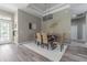 Elegant dining room with modern chandelier, stylish decor, and plenty of natural light at 2957 Hickory Grove Dr, Valrico, FL 33596