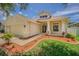Charming home with a well-manicured lawn, neat mulch beds, and a welcoming covered entryway at 2957 Hickory Grove Dr, Valrico, FL 33596