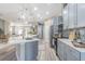 Contemporary kitchen featuring stainless steel appliances, a large island, and an open layout at 2957 Hickory Grove Dr, Valrico, FL 33596
