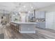 Modern kitchen featuring stainless steel appliances, a large island, and sleek gray cabinetry at 2957 Hickory Grove Dr, Valrico, FL 33596