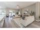 Comfortable living room showcasing neutral tones, stylish furnishings, and plenty of natural light at 2957 Hickory Grove Dr, Valrico, FL 33596