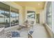 Inviting screened-in patio with stylish furniture and sliding glass doors, perfect for outdoor relaxation at 2957 Hickory Grove Dr, Valrico, FL 33596