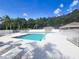 Community pool with lounge chairs and a covered area, perfect for relaxing on a sunny day at 2957 Hickory Grove Dr, Valrico, FL 33596