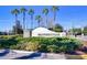 Well-maintained community entrance sign amidst lush greenery and palm trees, showcasing the 'Heatherstone' community at 31349 Philmar Ln, Wesley Chapel, FL 33543