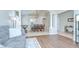 Open floor plan featuring formal dining room with chandelier, and living room in the distance at 31349 Philmar Ln, Wesley Chapel, FL 33543