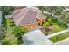 Bird's-eye view of home with a large driveway, two-car garage, mature landscaping, and inviting entryway at 3824 Duke Firth St, Land O Lakes, FL 34638