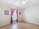 Neutral bedroom featuring a window with curtains and neutral flooring at 3824 Duke Firth St, Land O Lakes, FL 34638