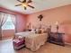 Inviting bedroom with soft lighting, and tiled floor at 3824 Duke Firth St, Land O Lakes, FL 34638