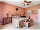 Comfortable bedroom is illuminated with warm lamps on side tables at 3824 Duke Firth St, Land O Lakes, FL 34638