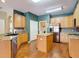 Well-lit kitchen featuring stainless steel appliances, granite countertops, and wood cabinets at 3824 Duke Firth St, Land O Lakes, FL 34638