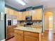 Kitchen island with granite countertop, stainless steel appliances, and ample cabinet space at 3824 Duke Firth St, Land O Lakes, FL 34638