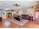 Cozy living room showcasing hardwood floors and seamless access to the adjacent kitchen space at 3824 Duke Firth St, Land O Lakes, FL 34638
