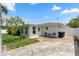 The backyard shows a patio, mature landscaping, lush grass, and a well-maintained exterior at 3839 18Th N Ave, St Petersburg, FL 33713