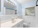 Bright bathroom featuring white tile, tub and shower, and classic vanity with solid surface top at 3839 18Th N Ave, St Petersburg, FL 33713