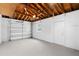 The garage features a modern door, concrete floor, high ceiling, and bright lighting at 3839 18Th N Ave, St Petersburg, FL 33713