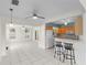 Open-concept kitchen with a breakfast bar and seamless flow into the living and dining areas at 3839 18Th N Ave, St Petersburg, FL 33713