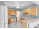 Bright kitchen features wood cabinets, tile flooring, stainless appliances, and a breakfast bar at 3839 18Th N Ave, St Petersburg, FL 33713