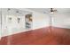 Open-concept living area with hardwood floors, neutral paint and a bar with seating overlooking the kitchen at 3839 18Th N Ave, St Petersburg, FL 33713