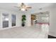Bright living room featuring tile floors and open layout with views to the kitchen and patio at 3839 18Th N Ave, St Petersburg, FL 33713