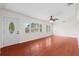 Bright and airy living room with hardwood floors, neutral paint, lots of natural light and a ceiling fan at 3839 18Th N Ave, St Petersburg, FL 33713