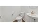 Stylish half bathroom featuring a pedestal sink and modern fixtures at 4020 Via Sienna Cir, Sarasota, FL 34243