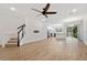 Spacious living area with hardwood floors and a staircase leading to the upper level at 4020 Via Sienna Cir, Sarasota, FL 34243