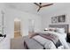 Inviting main bedroom with a ceiling fan, plush carpet, and ample natural light at 4020 Via Sienna Cir, Sarasota, FL 34243