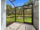 Outdoor screened patio with a brick floor and a view of the private backyard at 4020 Via Sienna Cir, Sarasota, FL 34243