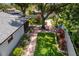 Aerial view of a fenced backyard with a mature tree and play structure on the property at 4124 Herrick Ln, Sarasota, FL 34241