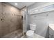 Modern bathroom with tiled shower, toilet, and vanity at 4124 Herrick Ln, Sarasota, FL 34241