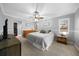 Spacious bedroom with carpet, ceiling fan, and windows providing natural light at 4124 Herrick Ln, Sarasota, FL 34241