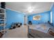 Spacious bedroom with carpet, light blue walls, two windows, and plenty of storage for decor at 4124 Herrick Ln, Sarasota, FL 34241