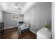 This is a cozy bedroom with hardwood floors, modern grey walls, and a beautiful trim at 4124 Herrick Ln, Sarasota, FL 34241