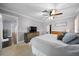 Bedroom with neutral walls, carpet, and view of adjoining dressing room at 4124 Herrick Ln, Sarasota, FL 34241