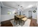 Dining room with a neutral palette, a decorative mirror, and a rustic wooden dining table at 4124 Herrick Ln, Sarasota, FL 34241