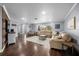 Bright living room with hardwood floors, comfortable seating, and large windows at 4124 Herrick Ln, Sarasota, FL 34241